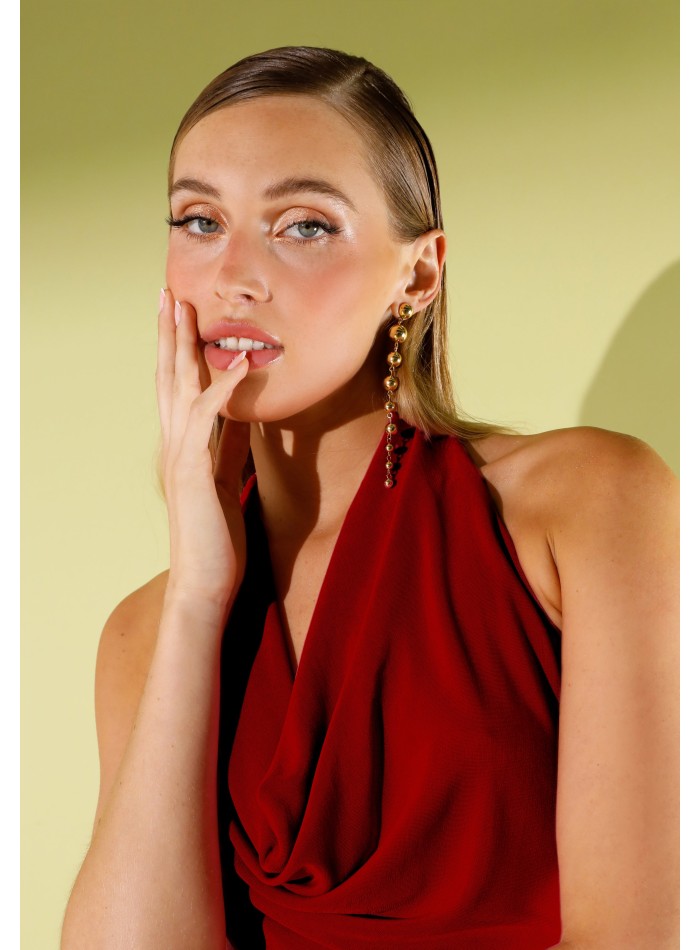 Long red knitted dress with draped cascade...