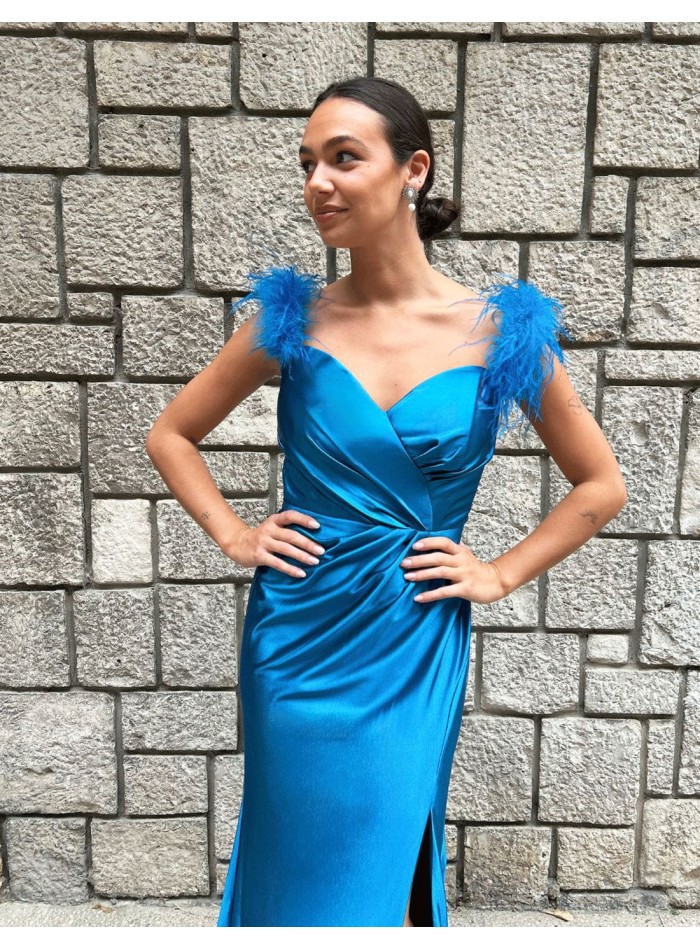 Party dress for guest with feathers on the shoulder