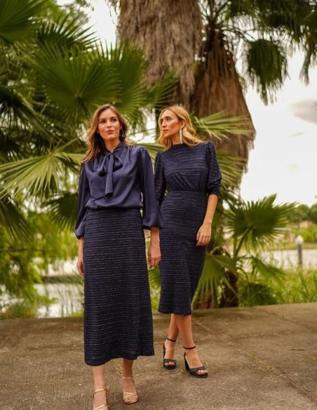 Navy blouse with shoulder pads and V-neckline