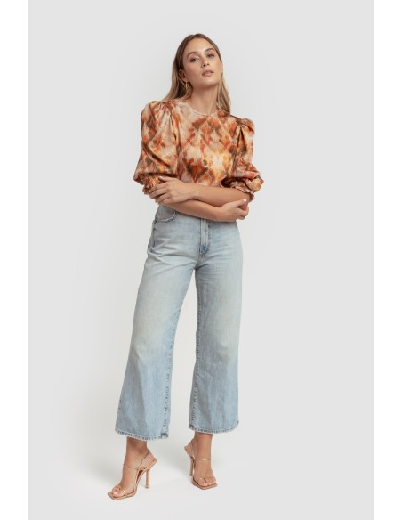 Orange lurex knit blouse with puffed sleeves