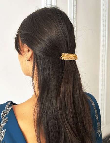 Golden barrette with pink crystals in the shape of leaves