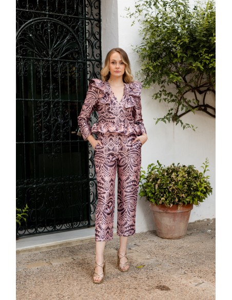 Pink printed blouse with peplum neckline and frill