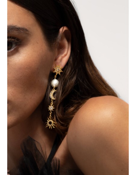 Long golden earrings with moons and stars
