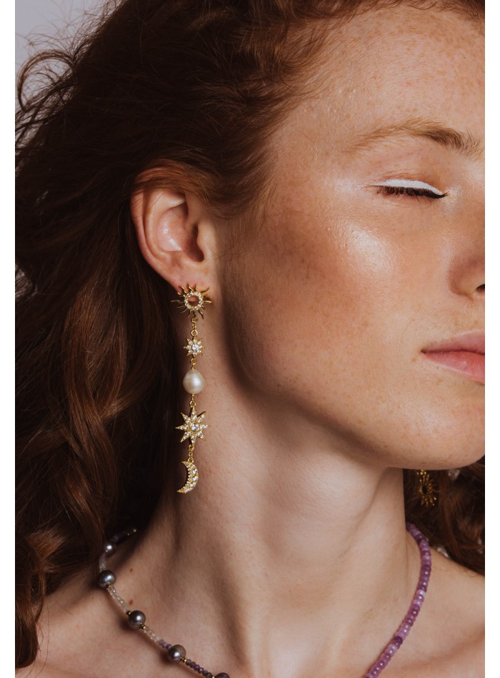 Long golden earrings with moons and stars