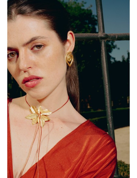 Golden necklace in the shape of lotus flower