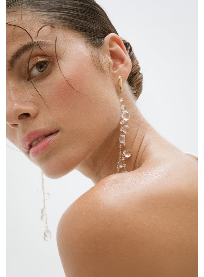 Long golden earrings with crystals