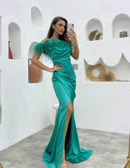 Long party dress with feathered bardot neckline and side slit