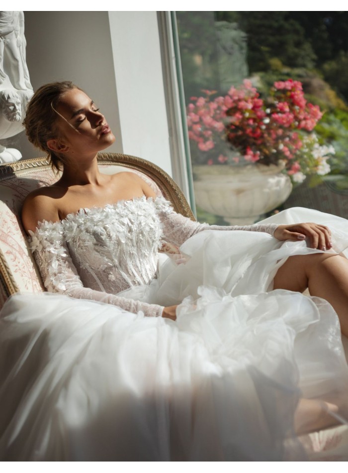 Long ivory wedding dress with lace neckline and rhinestones