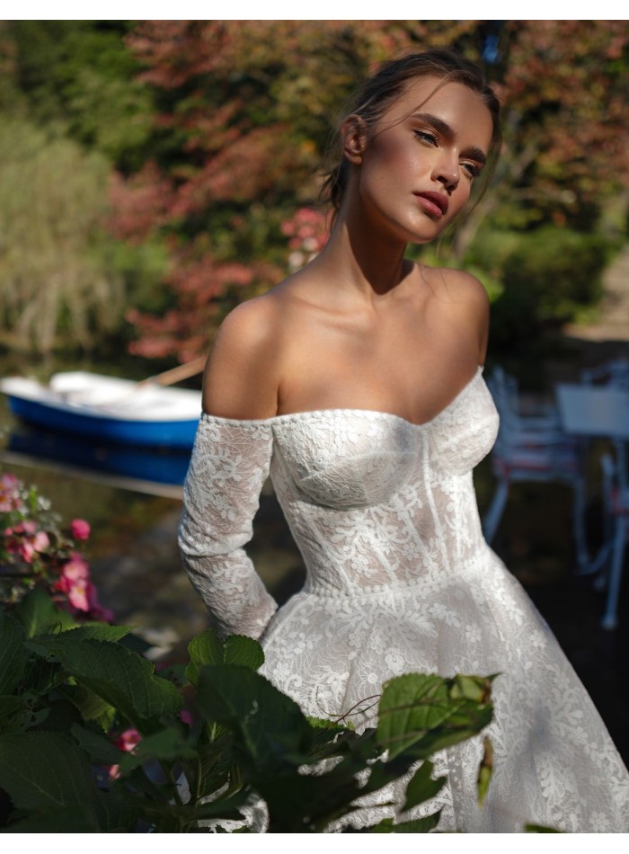 Long ivory wedding dress in lace with...