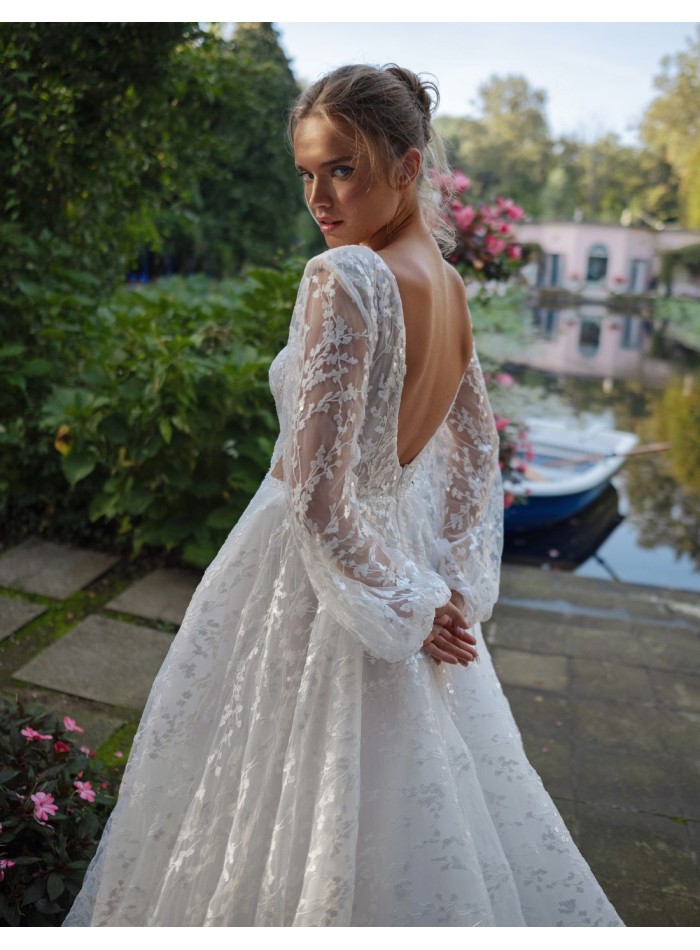 Long cut-out wedding dress with long puffed...