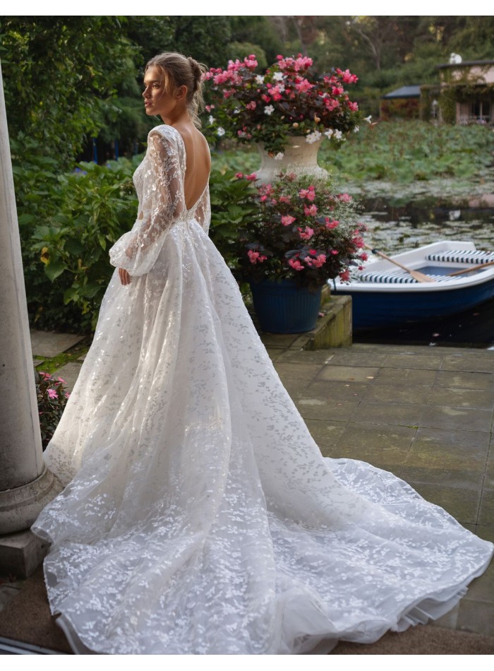 Long cut-out wedding dress with long puffed...