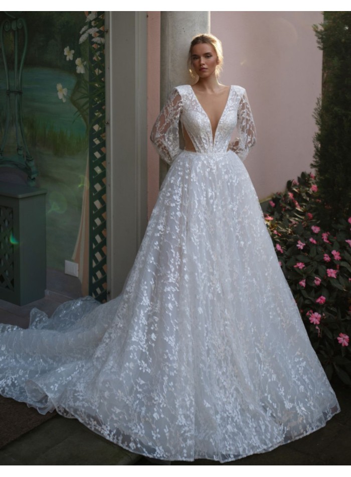 Robe de mariée longue et découpée avec manches longues bouffantes