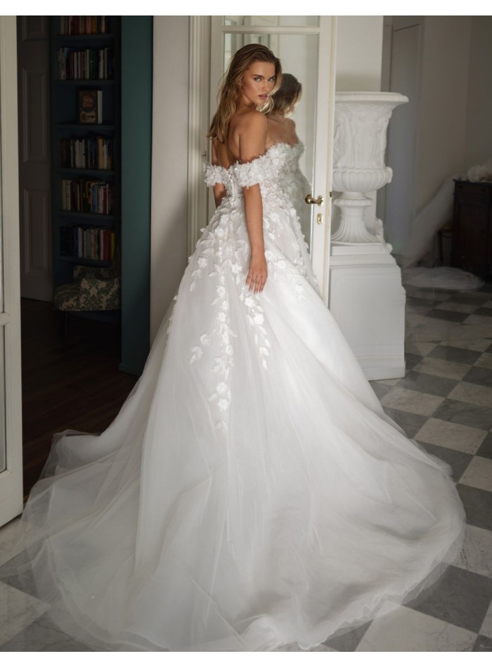 Long wedding dress with bandeau neckline and...
