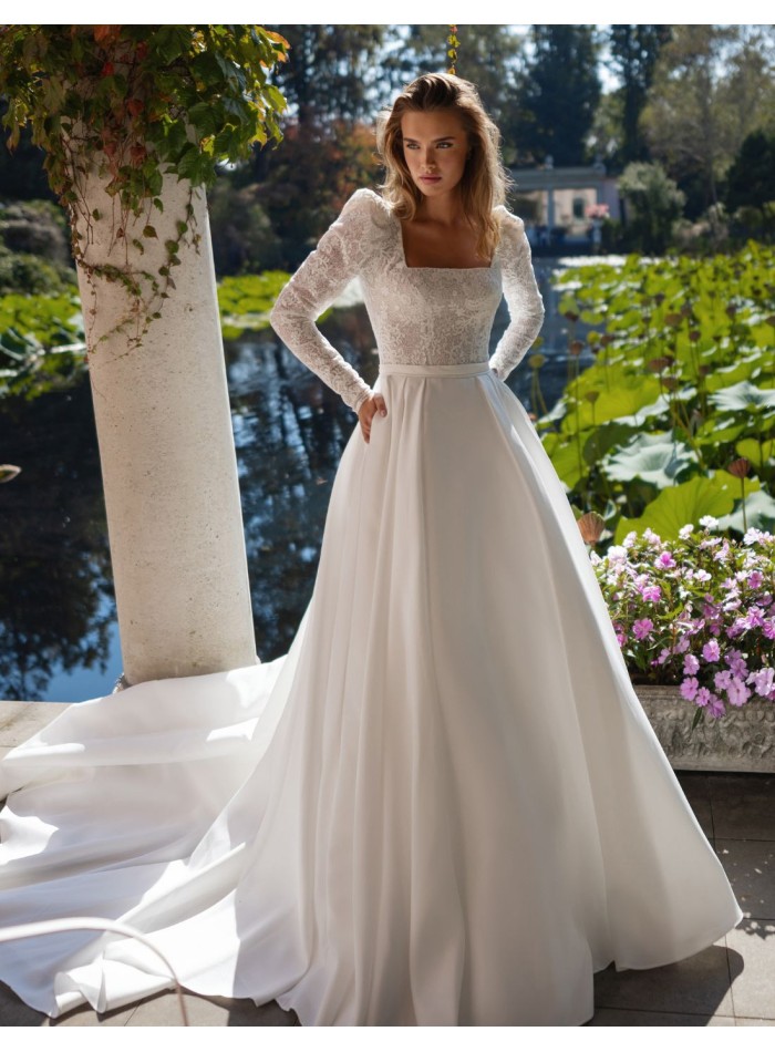 Ivory wedding dress with lace bodice and long...