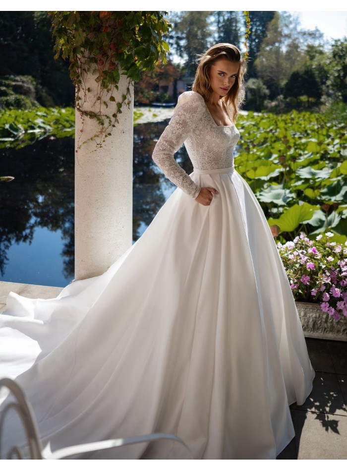 Ivory wedding dress with lace bodice and long...