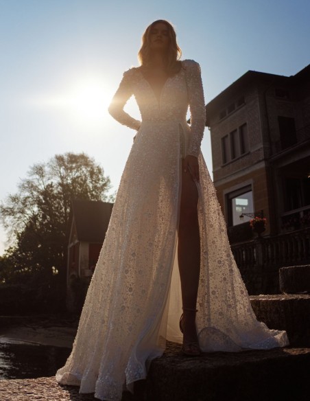 Ivory lace wedding dress with V-neckline and long sleeves