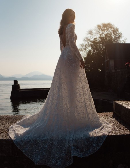 Ivory lace wedding dress with V-neckline and long sleeves