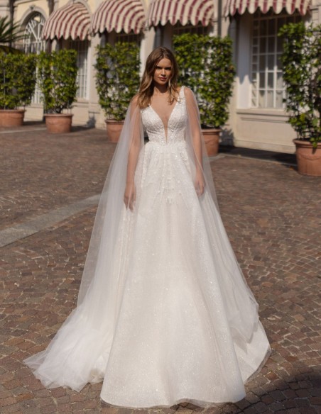 Robe de mariée ivoire, décolleté en V, dentelle et cape amovible