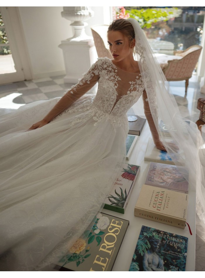 Ivory ivory wedding dress with illusion neckline, lace and princess silhouette