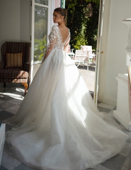 Ivory ivory wedding dress with illusion neckline, lace and princess silhouette