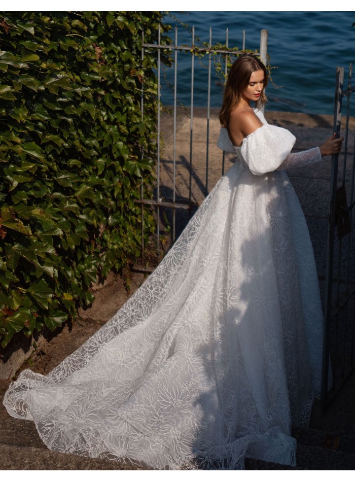 Ivory wedding dress with lace, open back and...