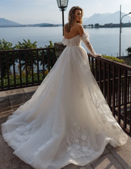 Ivory A-line wedding dress with sweetheart neckline, lace and sleeves