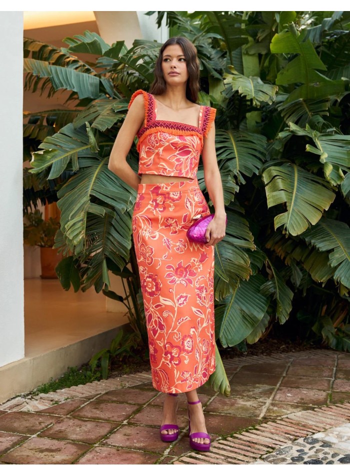 Orange printed top with bangs and wide straps