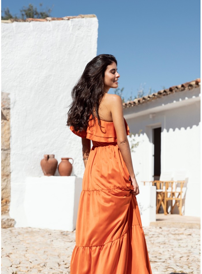 Long orange dress with ruffles and asymmetrical...