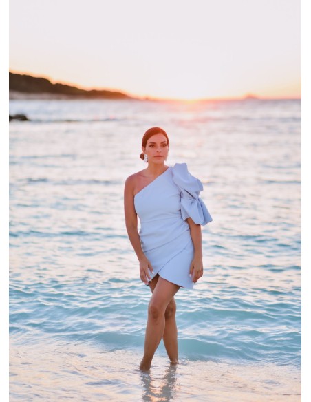 Short blue dress with asymmetrical neckline and puffed sleeves