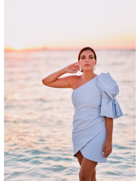 Short blue dress with asymmetrical neckline and puffed sleeves