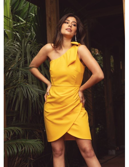 Short yellow dress with asymmetrical neckline and bow detail