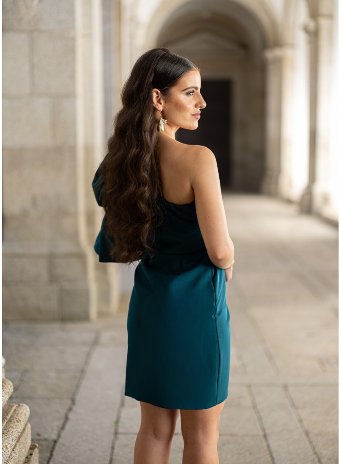 Short green dress with asymmetrical neckline
