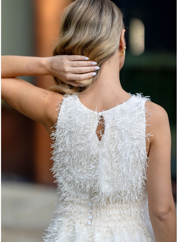 Vestido corto blanco con flecos