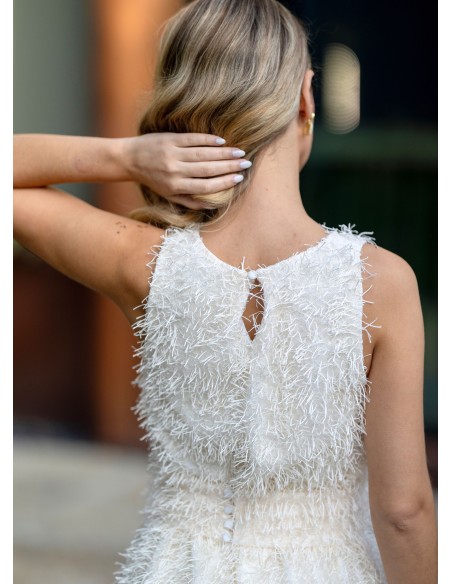 Vestido corto blanco con flecos