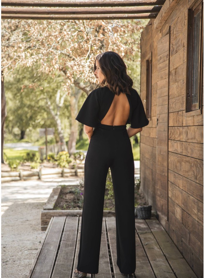 Black long jumpsuit with crossed neckline and...