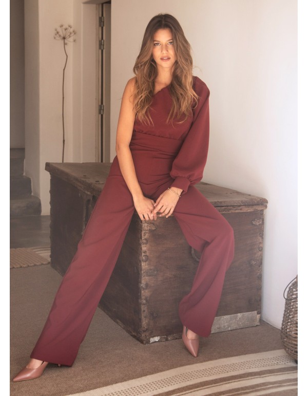 Long burgundy jumpsuit with asymmetrical neckline and...