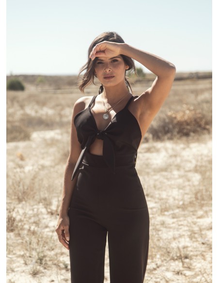 Black party jumpsuit knotted with suspenders