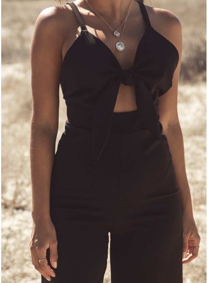 Black party jumpsuit knotted with suspenders