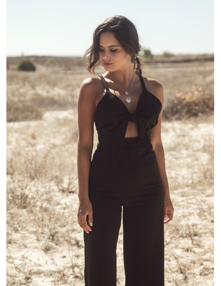 Black party jumpsuit knotted with suspenders