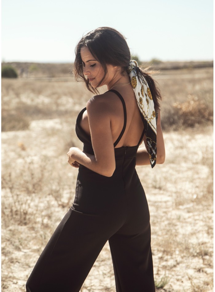 Black party jumpsuit knotted with suspenders