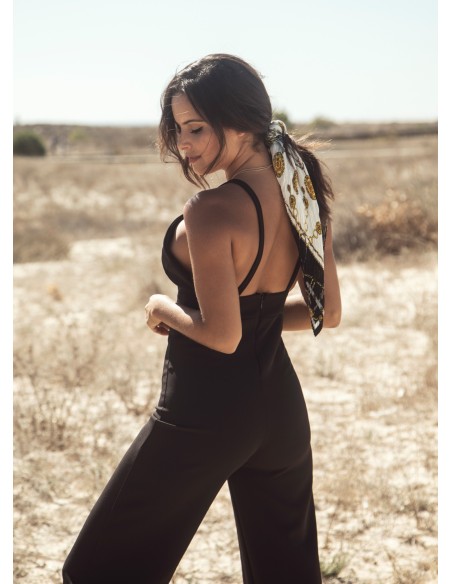 Black party jumpsuit knotted with suspenders