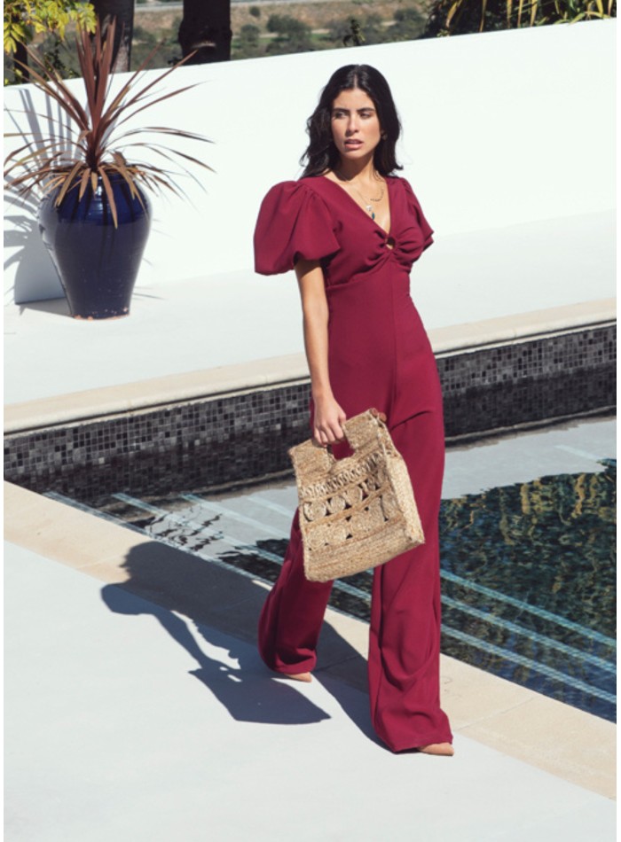 Burgundy jumpsuit with puffed sleeves and knotted back