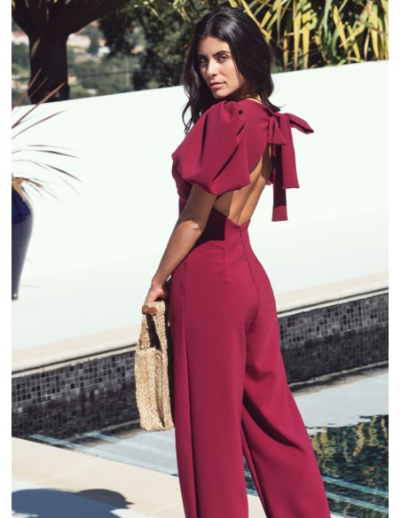 Burgundy jumpsuit with puffed sleeves and knotted back