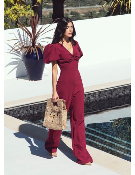 Burgundy jumpsuit with puffed sleeves and knotted back