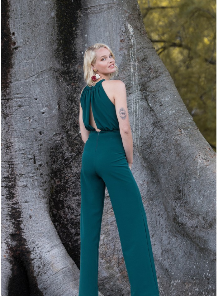 Green party jumpsuit with draped halter neckline