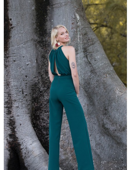 Green party jumpsuit with draped halter neckline