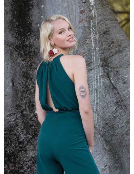 Green party jumpsuit with draped halter neckline