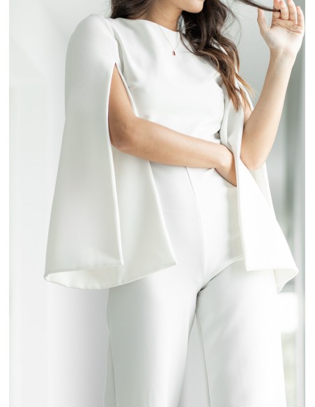 White jumpsuit with puffed sleeves and open back