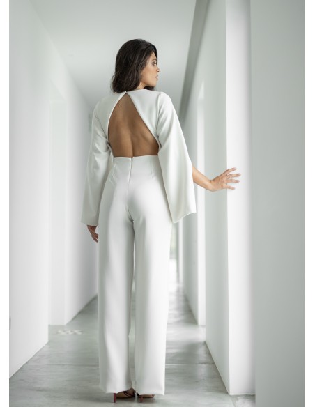 White jumpsuit with puffed sleeves and open back