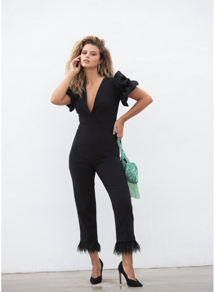 Black party jumpsuit with feathers and voluminous sleeves